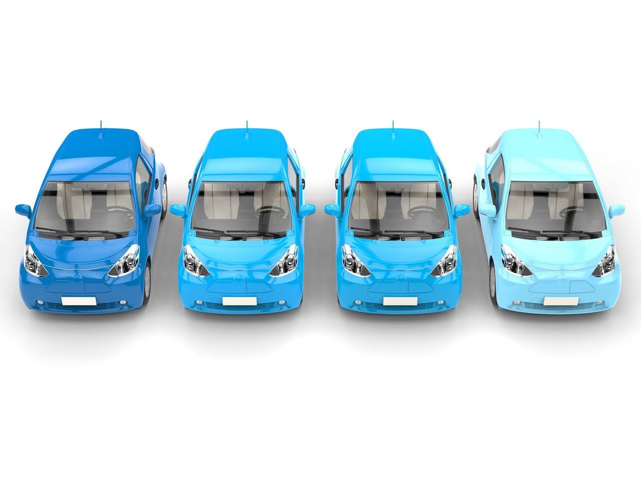 Flotte de véhicules électriques de fonction avec affichage digital des barèmes fiscaux révisés pour 2025-2026, illustrant la mobilité professionnelle durable.